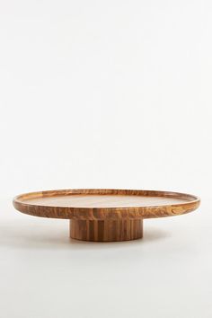 a wooden table with a white background