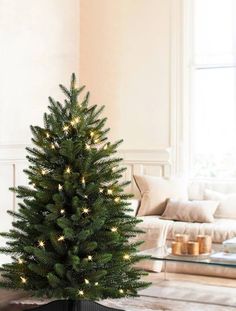 a small christmas tree in a living room