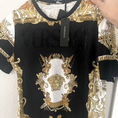 Versace T-Shirt Size 38. Brand New Luxury Graphic Print Short Sleeve T-shirt, Black Designer T-shirt With Monogram Print, Luxury Short Sleeve T-shirt With Graphic Print, Luxury Black Top With Logo Print, Luxury Black Short Sleeve Tops, Luxury Black T-shirt With Graphic Print, Designer Black Monogram Print Top, Luxury Monogram Print Short Sleeve T-shirt, Luxury Black Top With Graphic Print