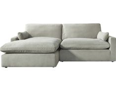 a white couch with pillows on it