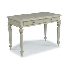 Find French farm-house charm in this Provence Desk by homestyles. Crafted of hardwood solids and mahogany veneers with engineered wood. A hand-applied, aged, off-white painted parchment finish and plank top add character. Features carved turned legs and finished on all four sides, so it can be used in the center of a room. Two lap storage drawers with raised-panel fronts and aged nickel-finished drawer pulls. Arrives at your door by parcel delivery service. Finish and measurements may vary. Asse Cottage Desk, White Wood Desk, Accent Furniture Living Room, Wood Office Desk, Writing Desk Modern, Modern Computer Desk, Off White Paints, Dining Sets Modern, French Farmhouse