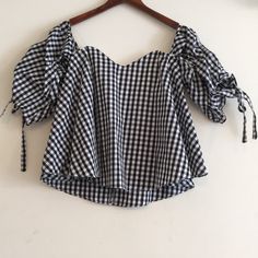 - Black/White Gingham - Sweetheart Neckline - 3/4 Ruched Sleeves - Adjustable Cuff Ties - Built In Zip Back Inner Bra With Boning And Rubber Gripping - Shell: 100% Cotton; Lining: 100% Rayon - Hand Wash Cold - Size S (Measurements Lying Flat, Please See Pictures For Measurement)(2nd And 3rd Photos Are Stock, Only Shows Look, Listing In Different Colors) - New With Tag Chic Short Sleeve Tops For Picnic, Gingham Short Sleeve Top For Brunch, Short Sleeve Gingham Tops For Brunch, Chic Gingham Blouse For Summer, Chic Gingham Blouse For Brunch, Plaid Blouse For Brunch, Chic Plaid Blouse For Picnic, Trendy Gingham Tops For Brunch, Plaid Cotton Blouse For Brunch