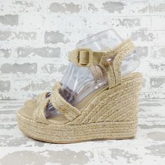 New Open Toe Buckled Ankle Strap Braided Raffia Straps And Midsole Raffia Upper, Raffia And Synthetic Lining, Rubber Sole Made In Spain Beige High Heel Wedge Sandals With Heel Strap, Natural Color Wedge Heel Sandals With Heel Strap, Natural Wedge Sandals With Heel Strap And Round Toe, Cream Wedge Sandals With Heel Strap For Summer, Vacation Wedge Sandals With Heel Strap Medium Width, Medium Width Wedge Sandals With Heel Strap For Vacation, Vacation Wedge Sandals With Heel Strap, Summer Cream Wedge Sandals With Heel Strap, Open Toe Straw Wedge Sandals With Heel Strap