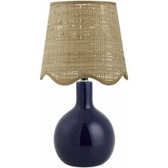 a blue table lamp with a burluck shade on the top and bottom of it