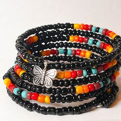 Made of beads and wire. 7 loops multi color beads memory wire bracelet. This handcrafted beaded bracelet is an excellent accent piece for a casual outfit. Memory wire provides easy application and removal. There are no complicated clasps and one size fits most. Black Bohemian Wrap Bracelet With Round Beads, Black Heishi Beads Bracelet With Colorful Beads, Multicolor Wire Wrapped Wrap Bracelet With Round Beads, Black Heishi Beads Bohemian Bracelet, Bohemian Black Heishi Beads Bracelets, Black Bohemian Heishi Beaded Bracelet, Bohemian Black Heishi Beads Bracelet, Black Multi-strand Bohemian Bracelets, Bohemian Black Multi-strand Bracelets