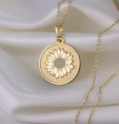 🌻🌞Imagine the gentle sway of sunflower petals, each one lovingly designed to capture the natural beauty of this cheerful flower. The vibrant motifs and delicate craftsmanship evoke feelings of happiness and serenity, like strolling through a sun-drenched field on a perfect day. 🌞🌻 * Gender : Male / Female * Material Options : Silver, Gold Plated, Rose Gold, 14K Solid Gold * Thickness of Silver Pendant: 1.0 mm * Thickness of Gold Pendant: 0.8 mm * The Gold Plated and The Rose Gold Plated opti White Flower Jewelry With Sunflower Design, White Flower-shaped Jewelry With Sunflower Design, Wedding Jewelry With Sunflower Design, White Sunflower Design Flower Jewelry, Mother's Day Sunflower Design Jewelry, Yellow Flower Pendant Necklace With Sunflower Design, Yellow Flower Shaped Jewelry With Sunflower Print, Yellow Flower-shaped Jewelry With Sunflower Print, Elegant Round Sunflower Design Necklace