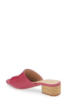 A glossy leather upper adds luxe appeal to a slide sandal lifted by a raffia-wrapped block heel. 1 3/4" heel Leather upper, lining and sole Imported Spring Mules With Cork-bed Midsoles And Flat Heel, Spring Flat Heel Mules With Cork-bed Midsoles, Pink Flat Heel Mules For Summer, Chic Pink Flat Slides, Summer Mules With Leather Sole And Block Heel, Summer Block Heel Mules With Leather Sole, Chic Pink Mules For The Beach, Chic Flat Sandals With Cork-bed Midsoles, Pink Open Heel Mules For Beach