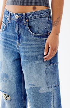 Look effortlessly cool and laid-back in these baggy, vintage-inspired jeans cut from nonstretch denim with paint splatter, rips and patchwork details. 27 1/2" inseam; 22" leg opening; 12" front rise; 14 1/2" back rise (size 29) Exclusive retailer Zip fly with button closure Five-pocket style 100% cotton Machine wash, line dry Made in Turkey Distressed Grunge Cargo Jeans For Spring, Distressed Medium Wash Cargo Jeans For Summer, Distressed Straight Leg Cargo Jeans For Summer, Summer Distressed Straight Leg Cargo Jeans, Distressed Relaxed Fit Cargo Jeans For Fall, Urban Distressed Cargo Jeans For Spring, Distressed Urban Cargo Jeans For Spring, Acid Wash Distressed Straight Leg Cargo Jeans, Acid Wash Ripped Relaxed Fit Jeans