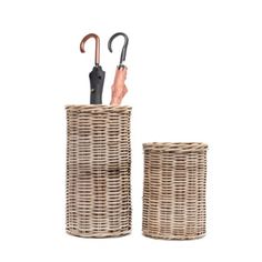 two wicker baskets with umbrellas in them