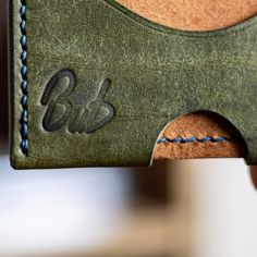 a close up of a wallet with stitching on it