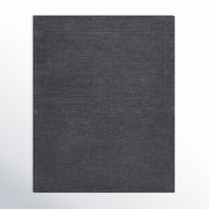 a black square rug on a white background