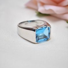 D E T A I L S - Stone: Natural Swiss Blue Topaz Stone Size: 10x12mm Material: 925 Sterling Silver The Fit: True to US ring size Finish: Silver & Smooth S H I P P I N G & P R O D U C T I O N - My current production time is 2-6 business days, which means after those days are up, your order ships! I make everything custom to order, by hand, but I promise you it's worth the wait! R U S H - M Y - O R D E R - If you're in a rush to get your pretty new pieces, please send me a message and I'll Formal Blue Topaz Gemstone Signet Ring, Formal Blue Topaz Signet Ring, Silver Blue Topaz Ring With Polished Finish, Classic Topaz Ring For Gifts, Classic Blue Topaz Ring With Polished Finish, Gift Blue Topaz Ring With Polished Finish, White Gold Rings With Polished Blue Topaz, Classic Blue Topaz Promise Ring, White Gold Blue Topaz Ring With Polished Finish