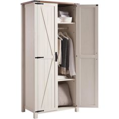 an armoire with doors open and clothes hanging on it