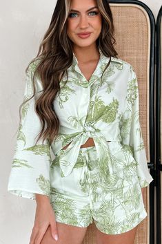 100% POLYESTER Model Wearing Size Small Color: Light Green Tropical Print Comes As A Set: Top & Shorts Top: Collared Shirt, Button-Front, Wide Sleeves, Loose/Slightly Oversized Fit Shorts: Elastic Waistband, Drawstring Tie, Front Pockets, Lined Top Does Not Have Stretch / Shorts Have Stretch In The Waistline Top: 16" Armpit To Sleeve End, 20" Armpit To Hemline Shorts: 13" High Rise, 2.5" Inseam Video Product Color May Not Be Accurate For Model Size Specs Please Check Size Charts Launched: 2/1/24 Summer Floral Print Long Sleeve Sets, Printed Long Sleeve Summer Sets, Green Long Sleeve Summer Sets, Spring Button-up Sets For Day Out, Summer Long Sleeve Sets For Brunch, Spring Vacation Long Sleeve Sets, Chic Long Sleeve Sets For Day Out, Long Sleeve Floral Print Sets For Beach, Summer Long Sleeve Sets For Day Out