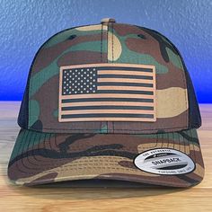 American Flag Patriotic SnapBack Trucker Patch Hat Camo/Black Hat Rawhide Patch Specifications: 🧢 SnapBack Trucker Hat; adjustable for the perfect fit 🎩 Cotton/polyester blend for comfort 📏 One size fits most 🏷️ Expertly laser engraved leatherette patch design 📦 Ships in 2 to 3 business days from our Orlando Studio Care Instructions: 🚫 Do not wash; spot clean only Please Note: 🌈 Colors may vary from photos based on your viewing screen. Orlando Studios, Leather Patch Hat, Hollow Point, Patch Hats, Laser Engraved Leather, Patch Hat, Creation Crafts, Black Camo, Patch Design