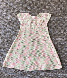 "Girl dress in pastel colors, white, pink and green. Dress is made with cotton and viscose yarn  Measurments: Dress fits for 2-4 years old girl ( based on the clothing size girl is wearing , some girls are smaller and some are bigger.  Dress measure: From neck total length 21\", around the waste 24\" I have the same dress, just smaller, please see my other listing Hand wash in warm water and dry flat" Handmade Pink Dress For Spring, Handmade Pink Dresses For Spring, Handmade Cotton Crochet Dress For Spring, Pink Crochet Summer Dress, Handmade Fitted Pink Dress, Cute Pink Crochet Dress For Summer, Cute Pink Crochet Dress For Spring, Cute White Crochet Summer Dress, Pink Sleeveless Cotton Crochet Dress