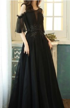 $109.90 Black Cold Shoulder Princess Evening Dress. This gown is made of a thick fabric. It is will make you look very elegant and feminine. This gown is perfect for balls and formal evenings. It will show your feminity and elegance. It is good for elegant ladies and seductive women. Black A-line Ball Gown For Formal Events, Black A-line Ball Gown For Formal Occasions, Black V-neck Gown For Banquet, Black Floor-length Prom Dress, Elegant Black A-line Ball Gown, Black Gown For Banquet During Prom Season, Black Ball Gown Evening Dress, Elegant Black Ball Gown Dress, Black Ball Gown For Prom Season And Banquet