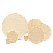 three wooden plates and two smaller ones with circles on them, all in different sizes