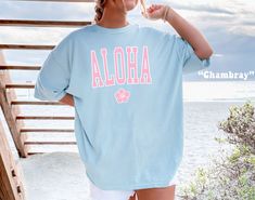 The ultimate Beach Shirt, get ready for Summer or Beachy Vacation with this cute Aloha Shirt! This Preppy Hawaii Comfort Colors® Tshirt is so comfy! Size up for a Trendy Oversized Look! ♥ Hello and Welcome to Meaningful Tees Shop! ♥ Models are wearing Comfort Colors® Chambray, Banana, Blossom ♥ All of our items are made one at a time with care for each customer : ) ♥ Please allow 3-7 BUSINESS days (usually 3-5) for your item to be created PLUS shipping time via USPS ♥ UNISEX TEES fit like a Mens Shirt on Women, but are not overly large. ♥ For a RELAXED FIT, your usual size will typically work, but please consult the Size Chart in the Listing Photos ♥ For a TRENDY OVERSIZED FIT, size up 1, 2, or 3 Sizes! (2 sizes up is most common) ♥ For a SNUG FIT, size down 1 size. ♥ When in doubt, lay yo Aloha Tshirt, Malibu Shirt, Florida Tshirt, Hawaii Tshirt, Banana Blossom, Florida Shirt, Summer Tees, Beach Tee, Comfort Colors Tshirt