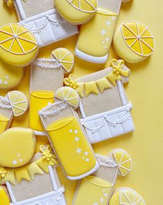 decorated cookies are arranged in the shape of lemonade and boots