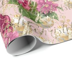 a pink and gold floral wallpaper with flowers on it's side wrapping paper