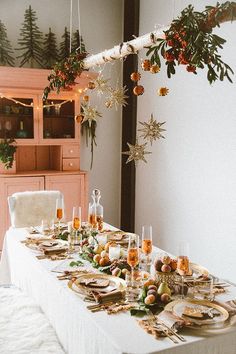 a long table with plates and glasses on it