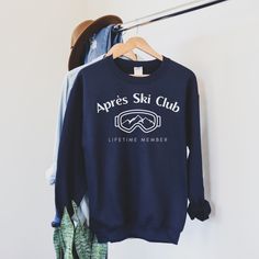 "Apres Ski Club Sweatshirt Gift for Ski Mom Winter Sport Sweater for Ski Clothes Women Ski Getaway Weekend Gift for Girls Trip Sweatshirts UNISEX HEAVY BLEND CREWNECK SWEATSHIRT ABOUT: Perfect for everyday wear and provides our comfort. No itchy side seams on these cozy sweaters. FEATURES: No side seams - knit in one piece  Ribbed knit collar with seam - highly elastic and retains its shape MATERIAL: 50% Cotton 50% Polyester CARE INSTRUCTIONS: Machine wash: COLD & INSIDE OUT Bleach: NO Tumble Dr Ski Clothes Women, Womens Ski Outfits, Ski Clothes, Ski Club, Women Ski, Sport Sweater, Club Sweatshirts, Skiing Outfit, Winter Sport