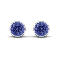 Product Details These simple yet classic Stud Earrings are designed with Round Cut Tanzanite in Bezel Setting. The earrings are crafted with Solid Gold to create an opulent appeal. Product Information SKU SHP-EARRINGS042169199 Length 4.6 mm Width 4.6 mm Weight 1.20 gm (Approximate) TANZANITE INFORMATION No.of Stones 2 Pieces Total Weight 1.08 Carat (Approximate) Dimension(approx) Round-5X5 mm-2 Pcs Color Blue Cut Brilliant Shape Round Setting Type Bezel-Setting Quality Grade AAA View More Produc Tanzanite Earrings, Solitaire Studs, Bezel Setting, Round Cut, Solid Gold, White Gold, Yellow Gold, Blue Color, Stud Earrings