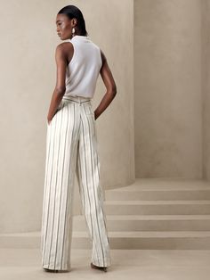 A wardrobe wonder, our designers chose a luxurious cotton-linen fabric for these flowing, wide-leg pants, specially woven with shades of beige and ivory for a striped effect that's ready for warm-weather adventures.  RELAXED WIDE-LEG FIT: High waiste Elegant Striped Summer Pants, Elegant Striped Pants For Summer, Elegant Summer Pants With Vertical Stripes, Elegant Striped Wide Leg Pants For Summer, Elegant Striped Linen Bottoms, Chic Striped Linen Bottoms, Striped Wide-leg Linen Pants, Striped Linen Wide-leg Pants, Chic White Wide Leg Pants With Vertical Stripes