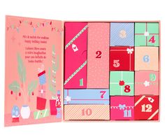 a pink box with lots of different colored boxes in it and numbers on the inside