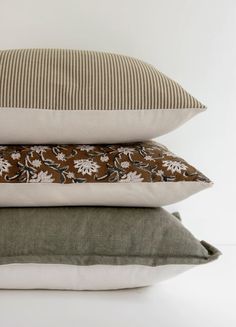 three pillows stacked on top of each other