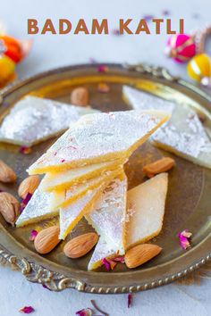 some almonds and other food on a plate with the words badam kati