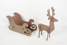 two wooden reindeer sleighs are shown on a white background, one is brown and the other is beige