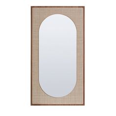 an oval mirror hanging on the wall next to a white wall and beige linen border