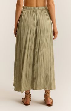 You're going to fall in love with this flowy midi skirt. The elastic waistband makes it so easy to wear and the crinkle fabric adds a slight sheen that sets it apart. Chic Relaxed Fit Maxi Skirt With Elastic Waistband, Chic Maxi Skirt With Elastic Waistband And Relaxed Fit, Rayon Midi Skirt For Day Out, Midi Length Rayon Skirt For Day Out, Rayon Midi Maxi Skirt For Day Out, Flowy Summer Midi-length Bottoms, Flowy Rayon Lined Skirt, Summer Rayon Maxi Skirt With Elastic Waistband, Flowy Rayon Tiered Maxi Skirt