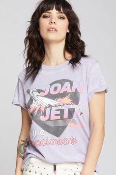 a woman with her hands on her hips wearing a t - shirt that says joan jettt