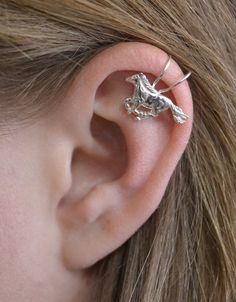 This is an extremely unique ear cuff featuring a running horse. It fits comfortably and securely on the top of your ear with no piercing. Spruce up your western style with this beautiful cuff. Metals available: *Gold Filled *Sterling Silver Available in: *Single Side *Pair Arrives in a pretty Gift Box and includes Simple Fitting Instructions. Perfect for gift giving! Unique Adjustable Pierced Ear Climbers, Adjustable Unique Style Ear Climbers, Unique Adjustable Nickel-free Ear Climbers, Unique Adjustable Pierced Ear Cuff, Unique Pierced Ear Cuff As A Gift, Adjustable Unique Ear Cuff, Unique Sterling Silver Cartilage Earrings, Fake Ear Piercings, Unique Ear Cuffs