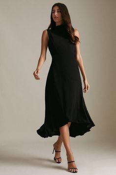 Dress To Impress With This Stylish Tailored Dress. Designed In A Mid-Length With A Figure-Flattering Fitted Waist, It Features A High Neck And Asymmetrical Hem For A Unique Touch.