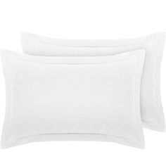 three white pillow cases on top of each other, one is plain and the other is plain