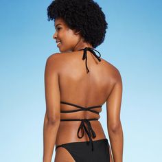 Triangle wrap bikini top from Wild Fable™ in black. Made from soft fabric with 4-way stretch and full lining for flexible comfort in and out of the water. Removable cups offer customizable coverage. Adjustable straps plus back and behind-neck ties provide the perfect stay-put fit. If you're not satisfied with any Target Owned Brand item, return it within one year with a receipt for an exchange or a refund. Wild Fable™: A look for every story. Vacation Swimwear With Wrap-around Straps, Stretch Triangle Halter Top With Removable Bra Pads, Black Swimwear With Bra Friendly 4-way Stretch, Black Swimwear With Bra-friendly 4-way Stretch, Black 4-way Stretch Swimwear, Bra Friendly, Fitted Triangle Top Swimwear, Versatile Fitted Triangle Top Swimwear, Versatile Black Halter Top With Built-in Bra, Beach Swimwear With Wrap-around Straps And Tie-side Bottom