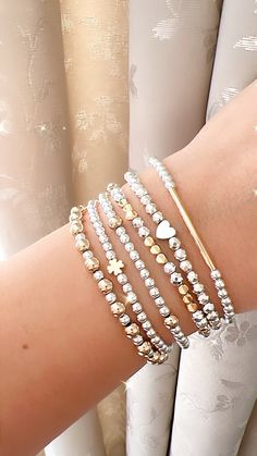 Two tone bracelet, gold and silver bracelet, mixed metal jewelry, elegant, dainty, minimalist bracelet stack, birthday gift for her, for mom Dainty, and elegant beaded bracelets !  ❣️Listing includes One bracelet. You can choose one or more bracelets, or the entire stack ( SUPER DEAL ❣️)  ❣️CREATE YOUR OWN STACK ❣️ These make fun, personalized gifts for moms, bachelorette parties, bridal showers, kids, flower girls, best friends...etc! Try personalizing with names, kids names, special words, phrases or affirmations, too  They are a stylish addition to any outfit, perfect for mixing, matching and stacking. The jewelry cord is elastic and will stretch slightly with wear.  - gold plated beads *long lasting color*   - silver hematite  Can be personalized. 🤍 ⭐️ Customise a bracelet with your n Dainty Silver Stackable Bracelets, Silver Dainty Stackable Bracelets, Dainty Metal Beaded Bracelets For Gifts, Dainty Gold Sterling Silver Bracelet, Delicate Gold-colored Sterling Silver Beaded Bracelet, Minimalist Gold Beaded Bracelet In Sterling Silver, Silver Metal Beaded Bracelets Dainty Style, Silver Metal Dainty Beaded Bracelets, Dainty Silver Metal Beaded Bracelets