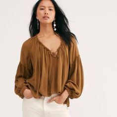 Free People Banda Blouse Nwt Size Small Ginger Snap New With Tag This Oversized, Boho Blouse Features A Front Tie Detail With A Flowy Silhouette, Exposed Seaming, & Ruched Hemlines. Exaggerated Sleeves With Pleating Throughout The Top. The Color Is Similar To Toasted Chestnut. If You Have A Short Torso The Length Will Not Be Cropped For You. Short Length Front & Back. Color Lighter Than Stock Pic. Exposed Seaming Drapey Silhouette Body Length Approx 23” Sleeve Length Approx 28” Beige Long Sleeve Tops With Blouson Sleeves, Beige V-neck Blouse With Relaxed Fit, Neutral V-neck Tops For Fall, Beige V-neck Blouse For Fall, Chic Brown Tops For Daywear, Brown Fall Blouse For Day Out, Casual Brown Beach Blouse, Brown Blouse For Day Out In Fall, Brown Blouse For Fall Day Out