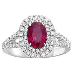 With this exquisite diamond and ruby ring, style and glamour are in the spotlight. This 18-karat diamond and ruby ring is made from 4.1 grams of gold. This ring is adorned with VS2, G color diamonds, made out of 72 diamonds totaling 0.58 carats, and 1 oval-shaped ruby totaling 1.14 carats. It comes in a size 6.5. Diamond Oval Ring, Diamond And Ruby Ring, Oval Diamond Ring, Oval Ring, Oval Rings, In The Spotlight, Ring Style, Ruby Diamond, Ruby Ring