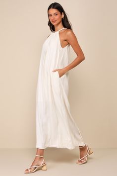 A sun-soaked vacay isn't complete without the Little Lies Ainsley Beige Pinstriped Linen Halter Maxi Dress with Pockets! Breezy, linen-blend woven fabric features a subtle pinstriped design as it shapes an adjustable, drawstring halter neckline with thick, tubular straps that tie above a keyhole cutout at the back. Relaxed bodice continues into a shift-style silhouette with side seam pockets and a maxi skirt with a fringe-adorned hem. Kick pleat at back. Fit: This garment fits true to size. Leng Casual Formal Dresses, Maxi Dress With Pockets, Lulu Fashion, Halter Maxi Dress, Adhesive Bra, Casual Wedding Dress, Kick Pleat, Halter Maxi, Linen Maxi Dress