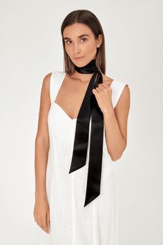 "Valerie Skinny Scarf is a stunning addition to any outfit. Wrap it around your neck in a care-free manner or carefully tie it to add an elegant touch. We also love to improvise and adorn our beach hat, tie around the waist or make a beautiful bow in our hair. Take your bold, contemporary self to the next level with the perfect accessory for work, day and night.  Handmade from fine 100% silk charmeuse/silk satin this silk skinny scarf will be your best friend - versatile and elegant.   color: black fabric: 100% silk charmeuse 14mm size: 69\" X 2.4\" (175cm x 6cm)" Satin Scarf, Silk Charmeuse, Beach Hat, Office Style, Style Expert, Office Fashion, Silk Scarves, Long Black, Black Silk