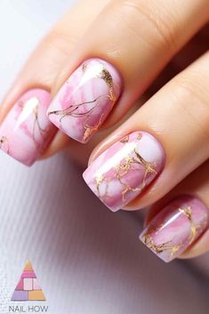 Ethereal pink marble nails with gold foil accents - perfect for summer! Get this chic pink summer nail design and more at nailhow.com Pink And Gold Nails Short, Marble Pink Nails, Pink And Gold Nail Designs, Pink Marble Nails, Marble Nails Tutorial, Pink Nail Art Designs