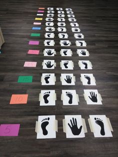 several handprints on the floor with different colors and shapes to make them look like footprints