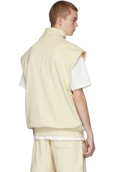 Essentials: Off-White Polar Fleece Vest | SSENSE Crew Neck Vest For Streetwear In Spring, Crew Neck Vest For Spring Streetwear, Solid Crew Neck Cotton Vest, Solid Color Cotton Vest For Streetwear, Solid Cotton Crew Neck Vest, White Winter Streetwear Vest, Cotton Crew Neck Vest, Winter Streetwear Vest Top, Cotton Sweater Vest For Spring Streetwear