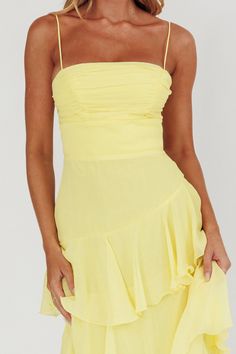 Back in stock! Our Parisian Summer Yellow Tiered Maxi Dress is the perfect wedding guest dress or sorority formal dress! Featuring a ruched bodice, spaghetti straps and a playful asymmetrical tiered skirt. Zipper back. Summer Strapless Tiered Dress With Ruffle Hem, Summer Strapless Tiered Skirt Dress With Ruffle Hem, Strapless Tiered Skirt Dress With Ruffle Hem For Summer, Brunch Dress With Fitted Bodice And Spaghetti Straps, Fitted Bodice Dress With Spaghetti Straps For Brunch, Brunch Dress With Spaghetti Straps And Fitted Bodice, Spaghetti Strap Dress With Fitted Bodice For Brunch, Flirty Summer Strapless Dress With Ruffled Skirt, Summer Date Night Strapless Dress With Ruched Bodice