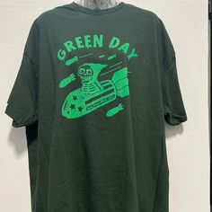 Concert. Green Day. Sea Hear Now Green Crew Neck Band Merch T-shirt, Green Band Merch T-shirt For Streetwear, Green Cotton Tops With Front Print, Green Graphic Print Shirt For Streetwear, Green Cotton T-shirt With Front Print, Green Band Merch T-shirt With Front Print, Green Fan Merchandise T-shirt With Text Print, Green T-shirt With Text Print For Fans, Green Screen Print Shirt For Streetwear